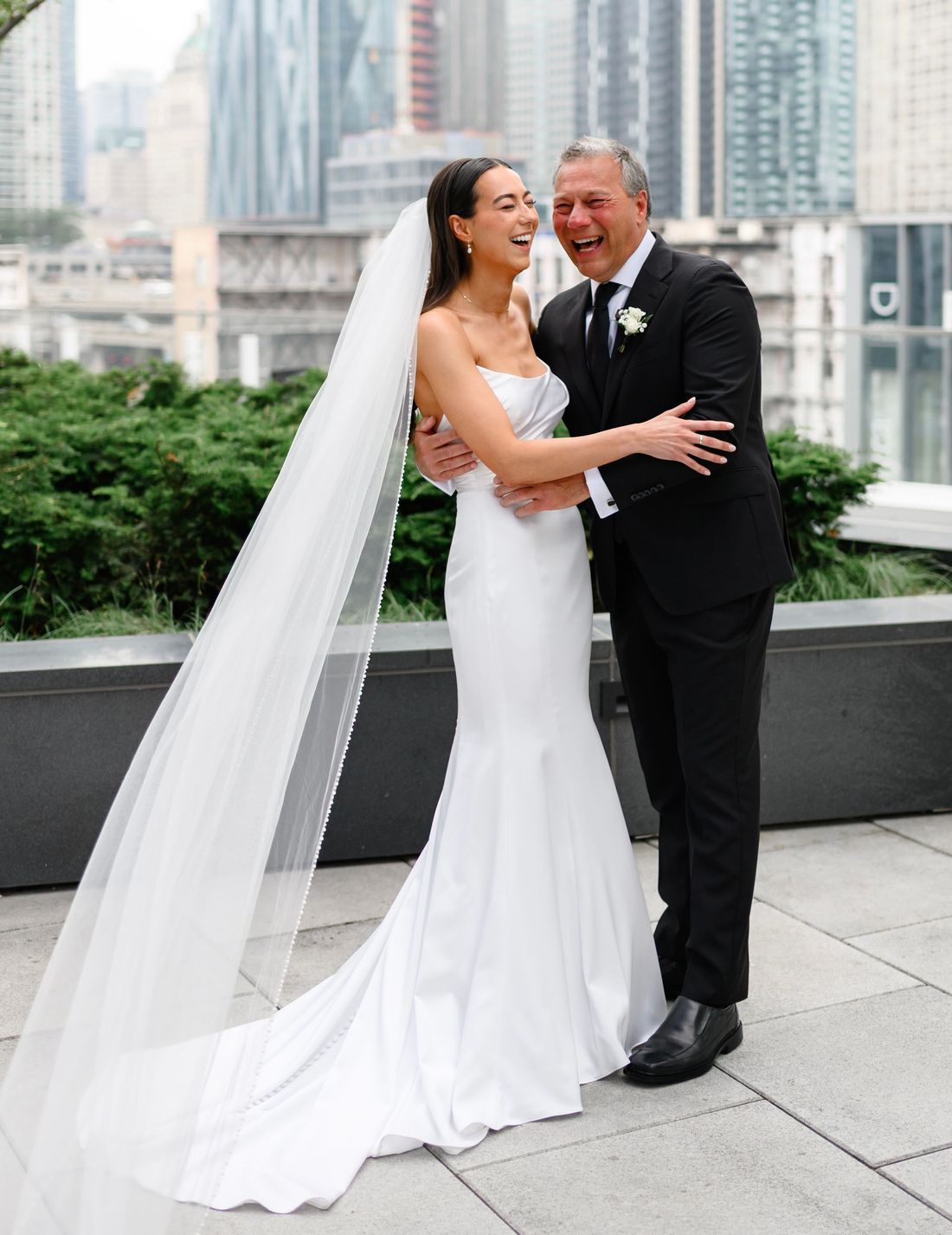 Father of the bride in a black bespoke suit